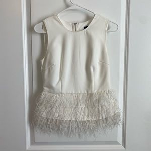 Lucy Paris White sleeveless top with feather trim at bottom, size XS